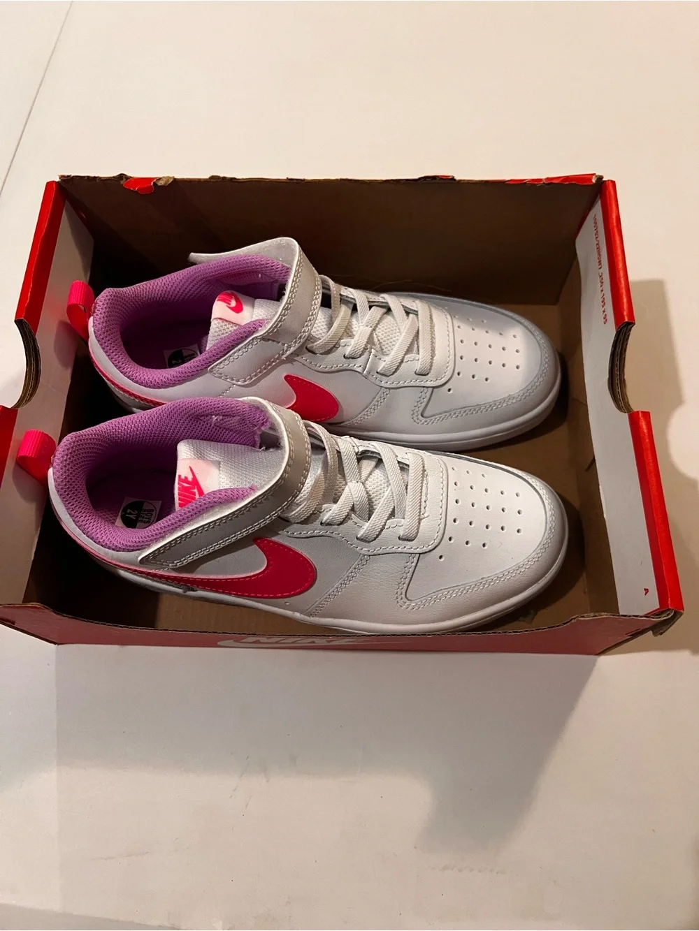 Nike Kids White Sneakers with Pink Accents